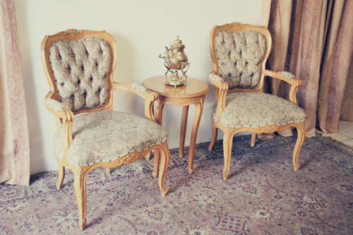 Two magnificent Victorian Oak hand carved chairs with deep button detailing!