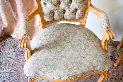 Two magnificent Victorian Oak hand carved chairs with deep button detailing!