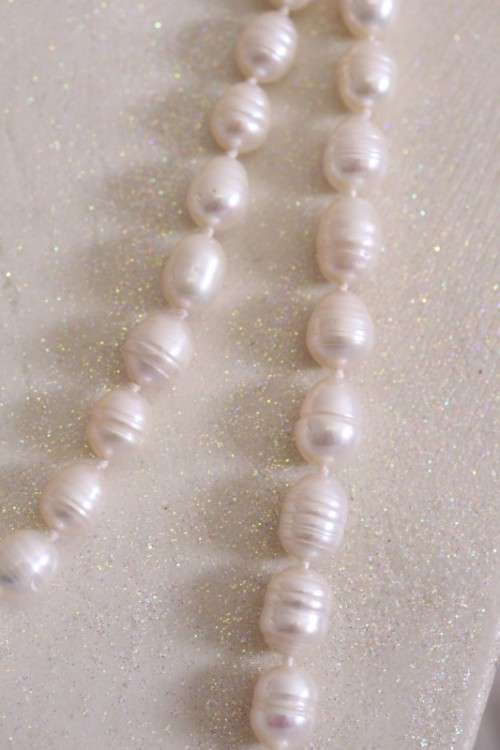 A beautiful 126cm endless-strand of white cultured baroque pearls in stunning condition