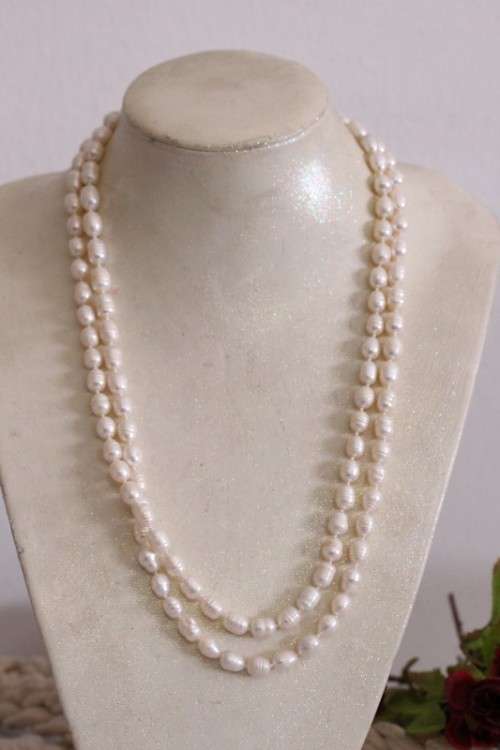 A beautiful 126cm endless-strand of white cultured baroque pearls in stunning condition