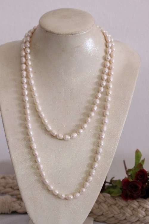 A beautiful 126cm endless-strand of white cultured baroque pearls in stunning condition