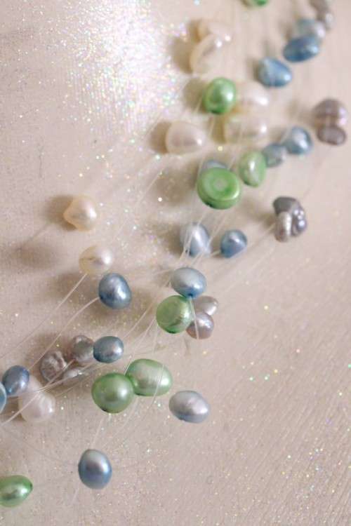 A superb white, blue, silver and green genuine pearl multi-strand ladies necklace w/ a silver clasp