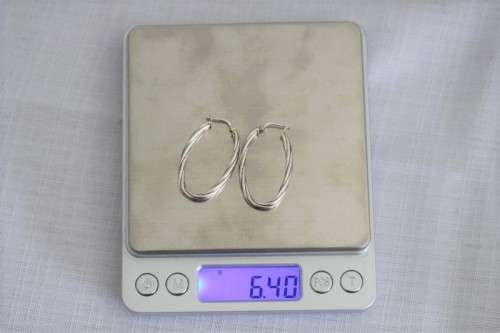 A superb pair of Italian made "twisted" sterling silver (925) ladies loop earrings for pierced ears