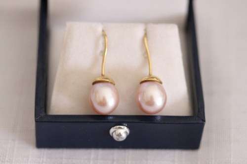 A stunning pair of pink Japanese Akoya pearl earrings with 9ct gold hooks in its original gift box
