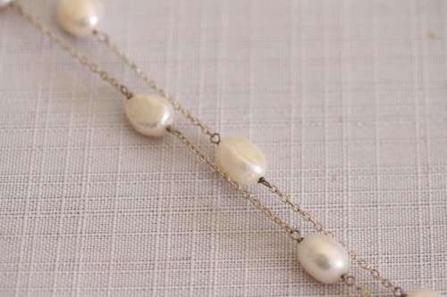A stylish 89cm long endless-strand of white cultured baroque pearls on a silver chain - stunning!!