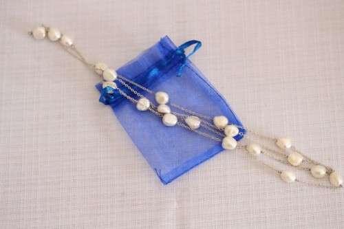 A stylish 89cm long endless-strand of white cultured baroque pearls on a silver chain - stunning!!