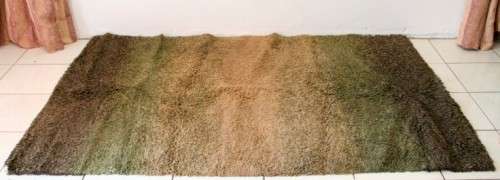 **RS17** A stunning Glowbal shaggy carpet with mixed shades of green and brown colours
