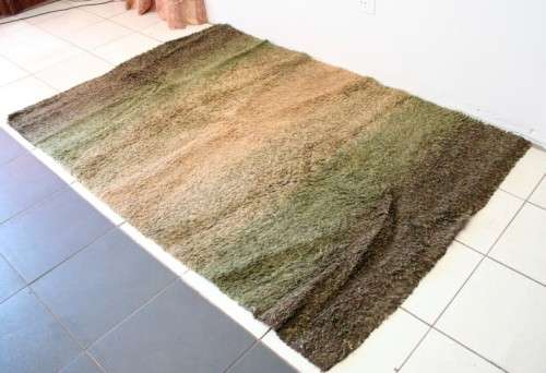 **RS17** A stunning Glowbal shaggy carpet with mixed shades of green and brown colours