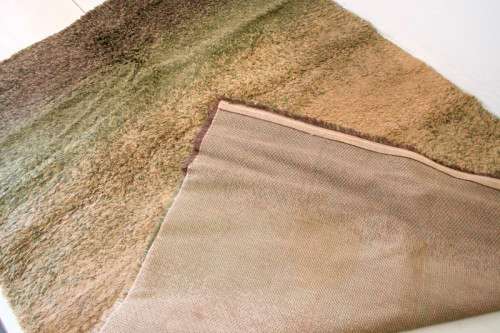**RS17** A stunning Glowbal shaggy carpet with mixed shades of green and brown colours