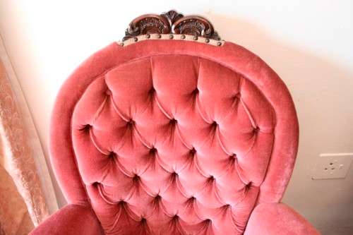 Two elegant hand carved Victorian arm chairs with deep button detailing & gorgeous pink fabric.