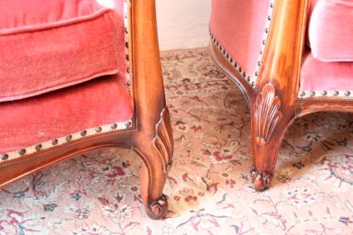 Two elegant hand carved Victorian arm chairs with deep button detailing & gorgeous pink fabric.