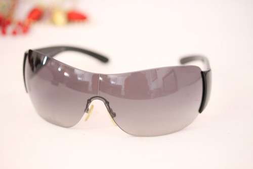 An awesome pair of black Italian made Prada (model SPR22M) ladies sunglasses w/ grey gradient lenses