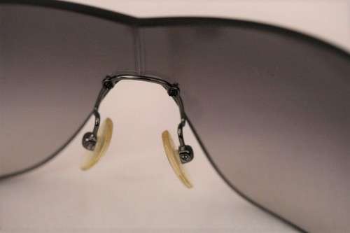 An awesome pair of black Italian made Prada (model SPR22M) ladies sunglasses w/ grey gradient lenses