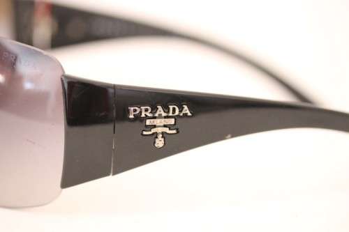 An awesome pair of black Italian made Prada (model SPR22M) ladies sunglasses w/ grey gradient lenses