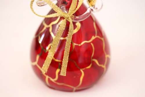 **RS17** A made hand-blown Italian red-glass angel finished with gold detailing by Flamigni