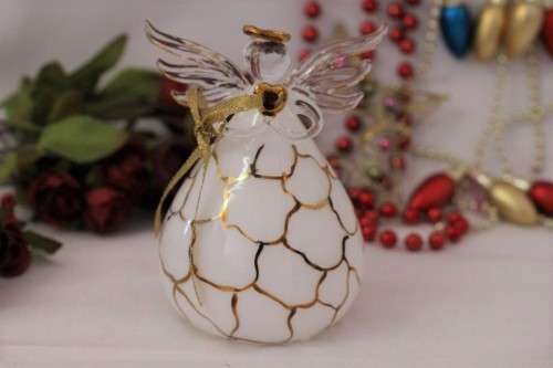 A gorgeous Italian made hand-blown white-glass angel finished with gold detailing by Flamigni
