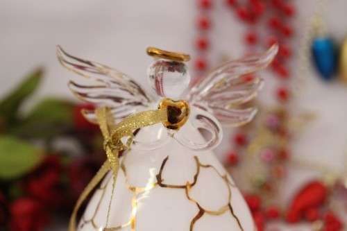 A gorgeous Italian made hand-blown white-glass angel finished with gold detailing by Flamigni