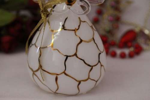 A gorgeous Italian made hand-blown white-glass angel finished with gold detailing by Flamigni