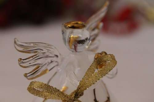 A gorgeous Italian made hand-blown white-glass angel finished with gold detailing by Flamigni
