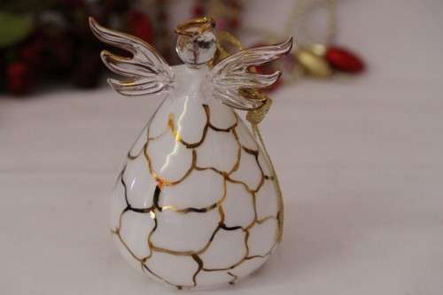A gorgeous Italian made hand-blown white-glass angel finished with gold detailing by Flamigni