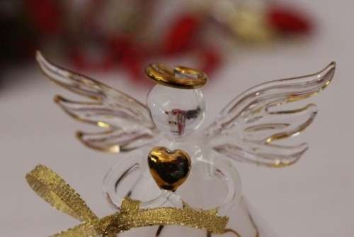 A gorgeous Italian made hand-blown white-glass angel finished with gold detailing by Flamigni