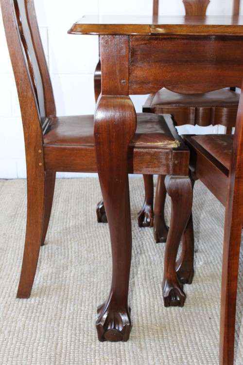 A superb vintage solid Imbuia ball and claw 6 to 8 seater dining suite with six Boston-back chairs