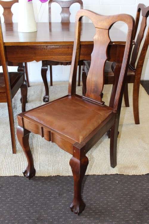A superb vintage solid Imbuia ball and claw 6 to 8 seater dining suite with six Boston-back chairs