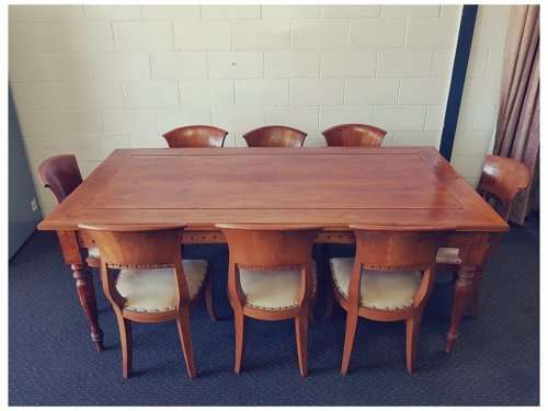 A magnificent Balinese Teak 8-seater dining suite with stylish upholstered curved-back chairs