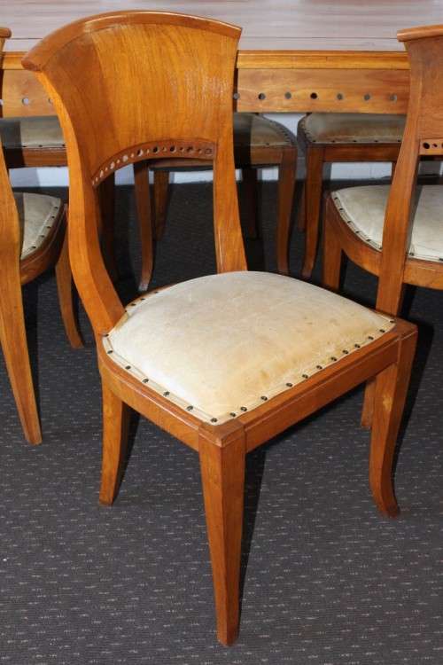 A magnificent Balinese Teak 8-seater dining suite with stylish upholstered curved-back chairs