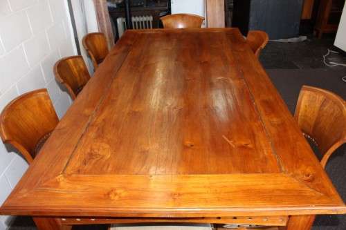 A magnificent Balinese Teak 8-seater dining suite with stylish upholstered curved-back chairs