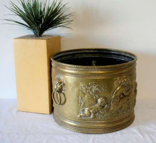 A lovely antique open bottomed solid brass pot plant with punched detailing.