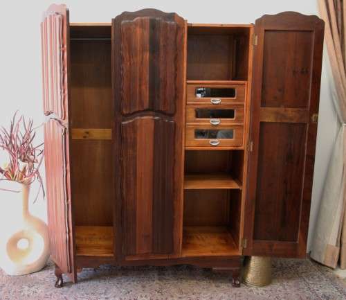 A stunning vintage Imbuia ball and claw three door wardrobe with three glass window drawers.