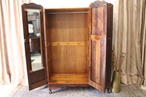 A stunning vintage Imbuia ball and claw three door wardrobe with three glass window drawers.