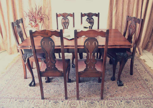 A stunning vintage Ball & Claw dining room suite with 6 fabulous carved chairs