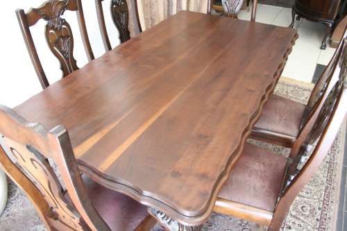 A stunning vintage Ball & Claw dining room suite with 6 fabulous carved chairs