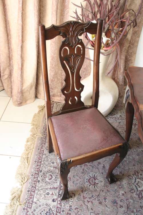 A stunning vintage Ball & Claw dining room suite with 6 fabulous carved chairs