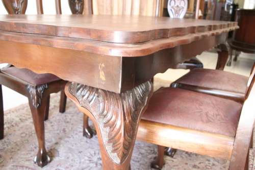 A stunning vintage Ball & Claw dining room suite with 6 fabulous carved chairs