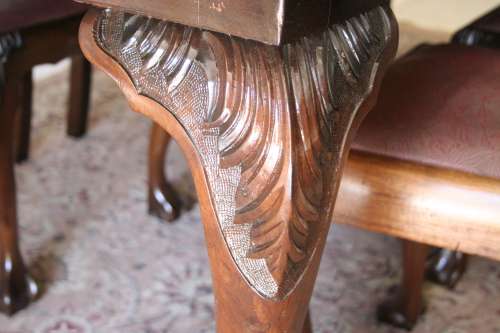 A stunning vintage Ball & Claw dining room suite with 6 fabulous carved chairs