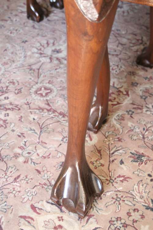 A stunning vintage Ball & Claw dining room suite with 6 fabulous carved chairs