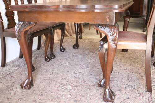 A stunning vintage Ball & Claw dining room suite with 6 fabulous carved chairs