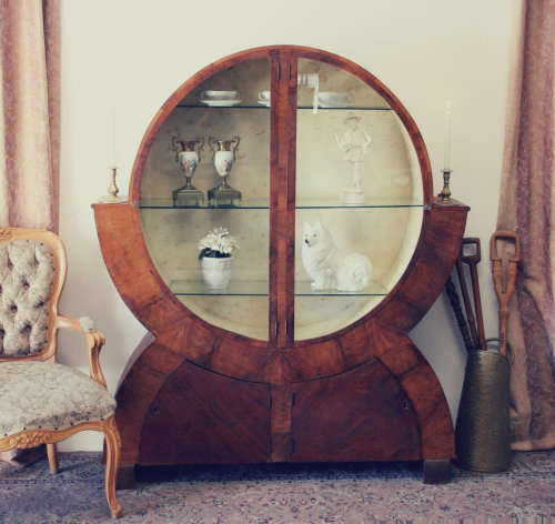 An elegant ART DECO (1930's) circular display cabinet with 3 shelves and bottom cupboards