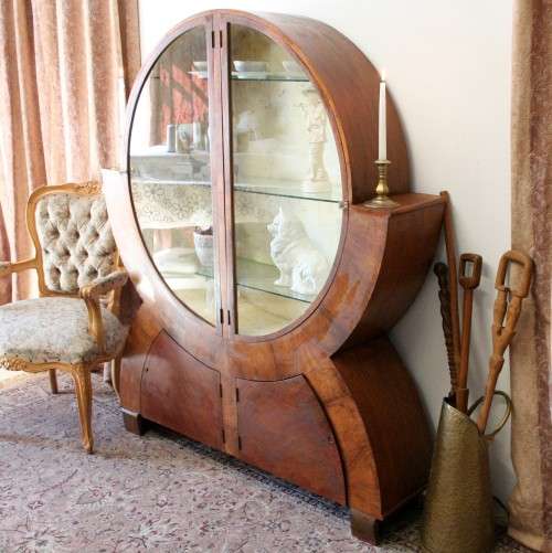 An elegant ART DECO (1930's) circular display cabinet with 3 shelves and bottom cupboards