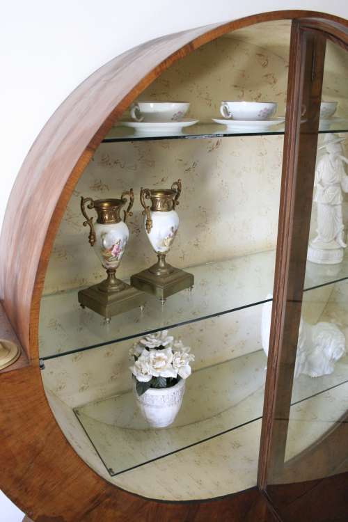 An elegant ART DECO (1930's) circular display cabinet with 3 shelves and bottom cupboards