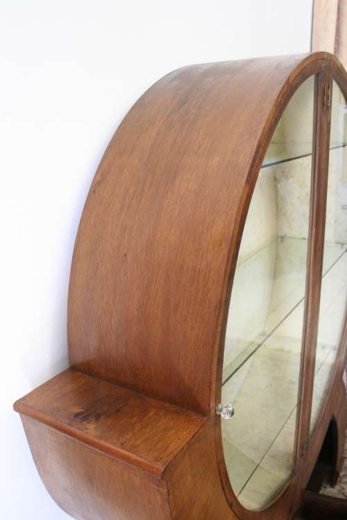 An elegant ART DECO (1930's) circular display cabinet with 3 shelves and bottom cupboards