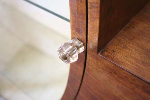 An elegant ART DECO (1930's) circular display cabinet with 3 shelves and bottom cupboards
