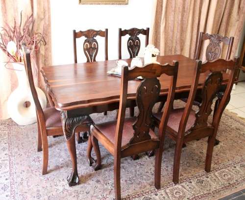 A stunning vintage Ball & Claw dining room suite with 6 fabulous carved chairs