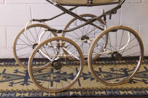 A rare vintage British made Marmet "coach-built" pram with drop-down canopy, foot brake & more