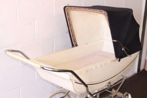 A rare vintage British made Marmet "coach-built" pram with drop-down canopy, foot brake & more