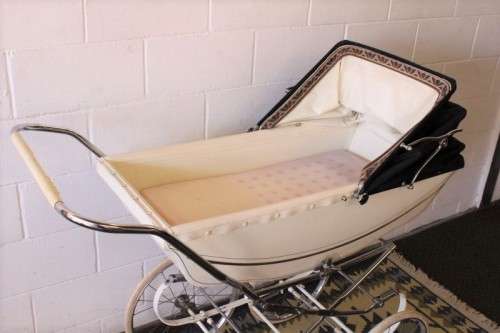 A rare vintage British made Marmet "coach-built" pram with drop-down canopy, foot brake & more