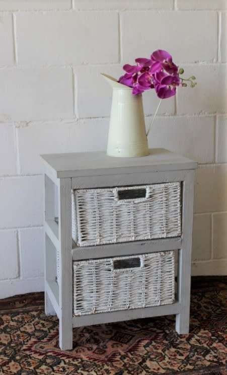 An awesome grey wooden 2-drawer pedestal with white wicker drawers - great in the bathroom